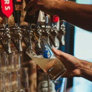 pouring glass of cider