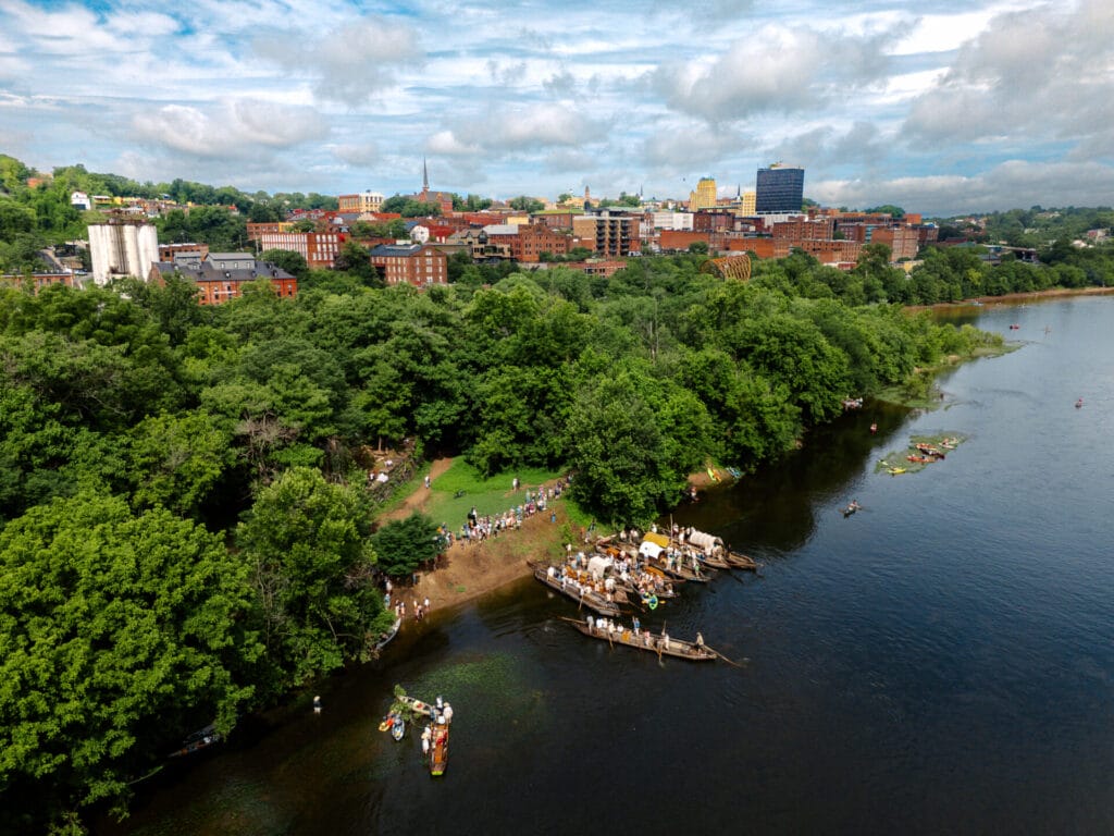 Aerial photo of Downtown Lynchburg; Photo taken at the 40th Annual Batteau Festival; Shows the batteau boats, kayaks, and people lining the trail
