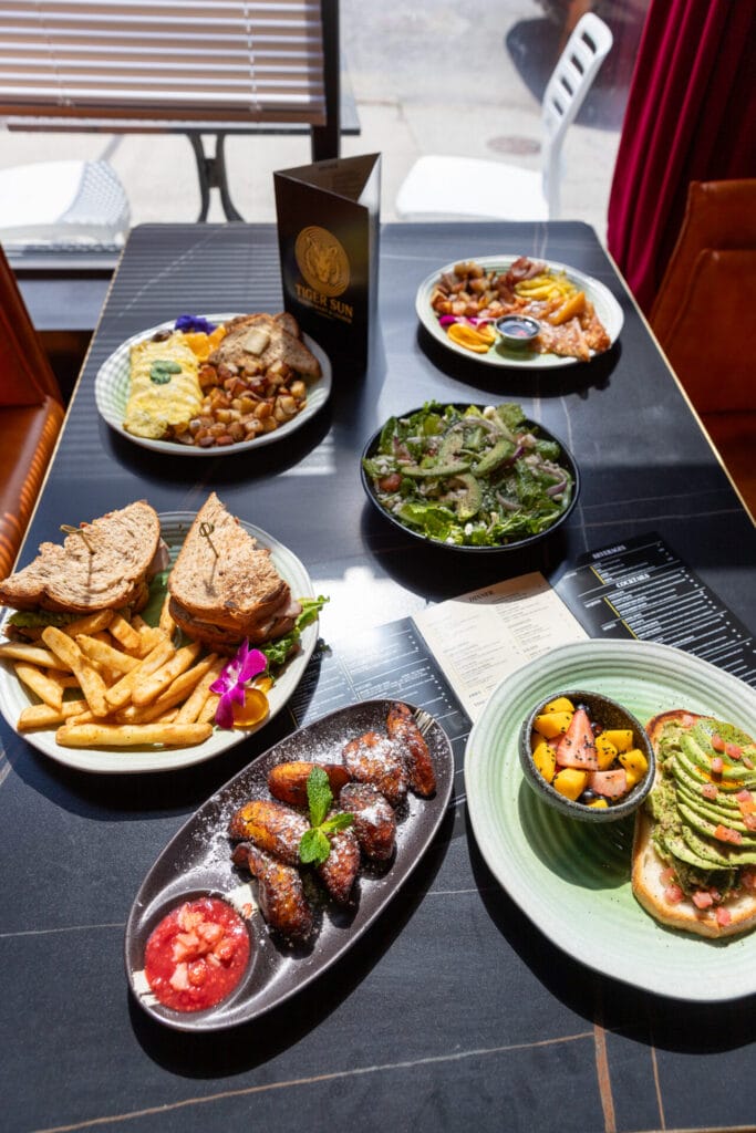 Breakfast and lunch sandwiches on table at Tiger Sun