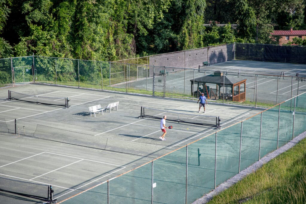 Two guys playing pickleball on the pickleball courts at Oakwood Country Club