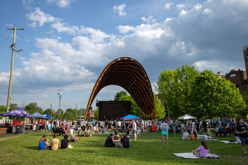 Exterior of Lynchburg Amphitheater with people sitting out on the lawn