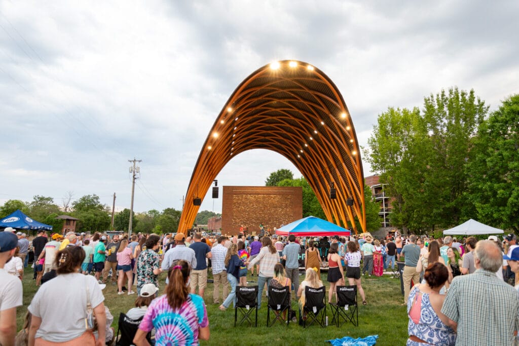 Exterior of Lynchburg Amphitheater with people sitting out on the lawn